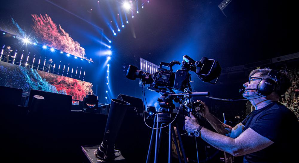 Camera operator filming a live stage production